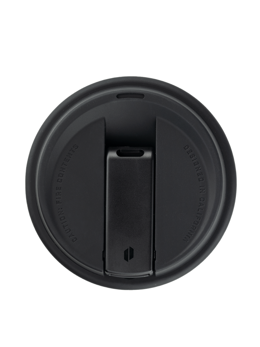 Overhead shot of Puffco black and white coffee cup pipe with closed mouthpiece 