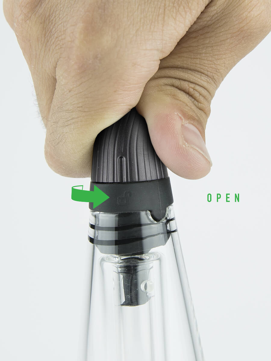 Hand adjusting mouthpiece on Puffco Peak Pro travel glass with a green right-facing arrow and "open" in green font