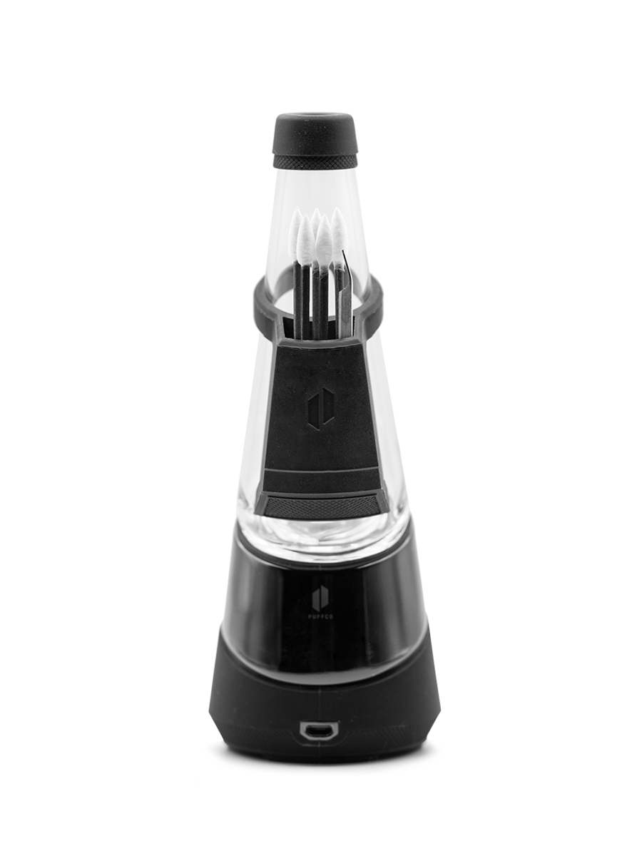Shot from behind of travel dab rig kit with cotton swabs in silicone backpack