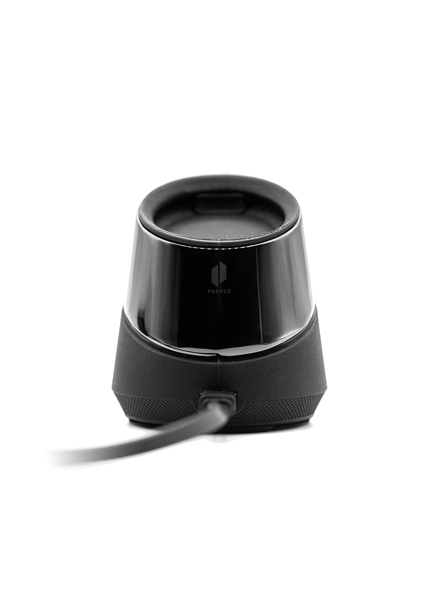 Front shot of black Puffco Peak charger dock against white backdrop