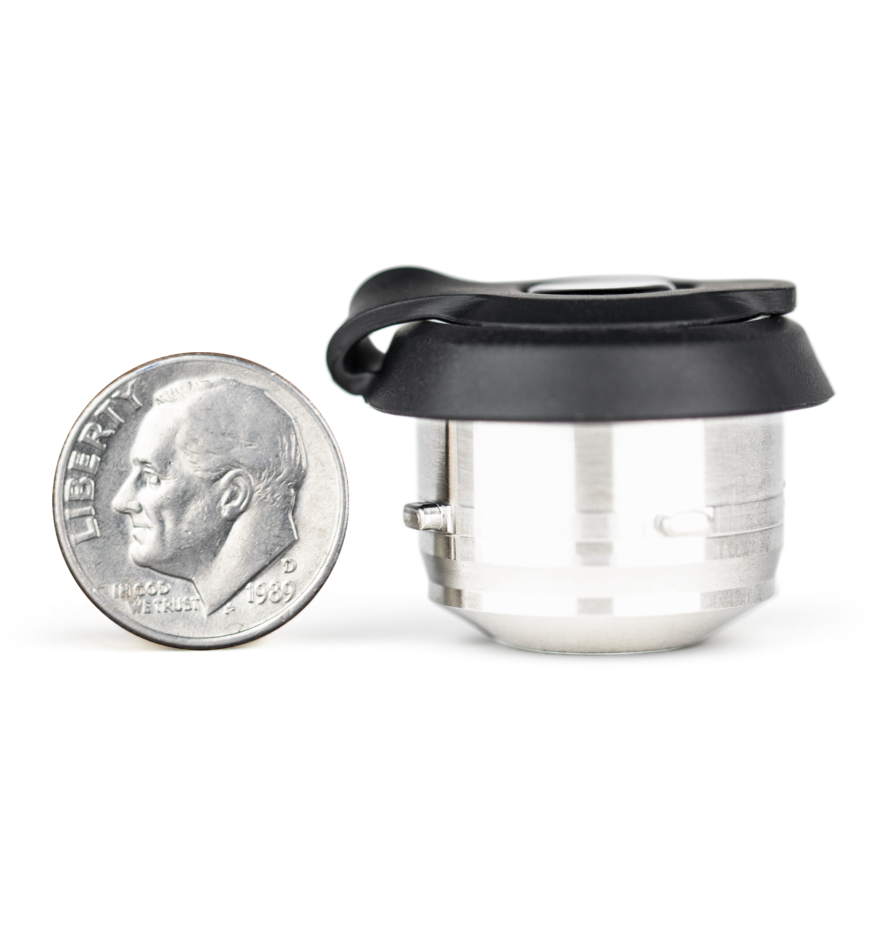 Side shot of black and silver Puffco Proxy chamber with quarter next to it for size comparison