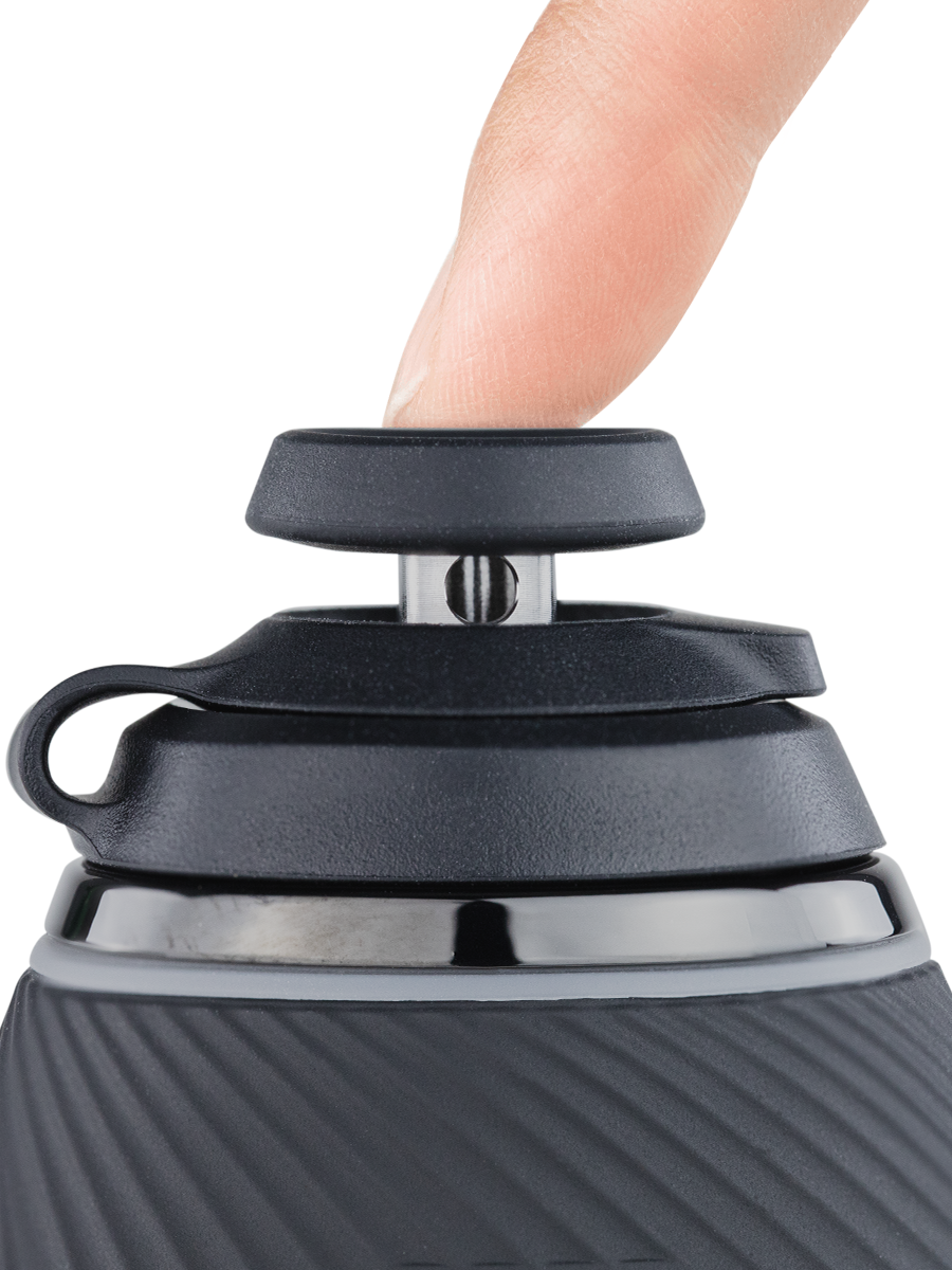 Close up side shot of black Puffco Proxy joystick cap connected to  black base with finger on top