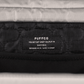 Close up of label inside of beige Puffco Proxy bag