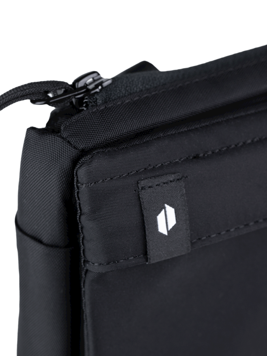 Close up of Puffco logo on black Proxy travel bag