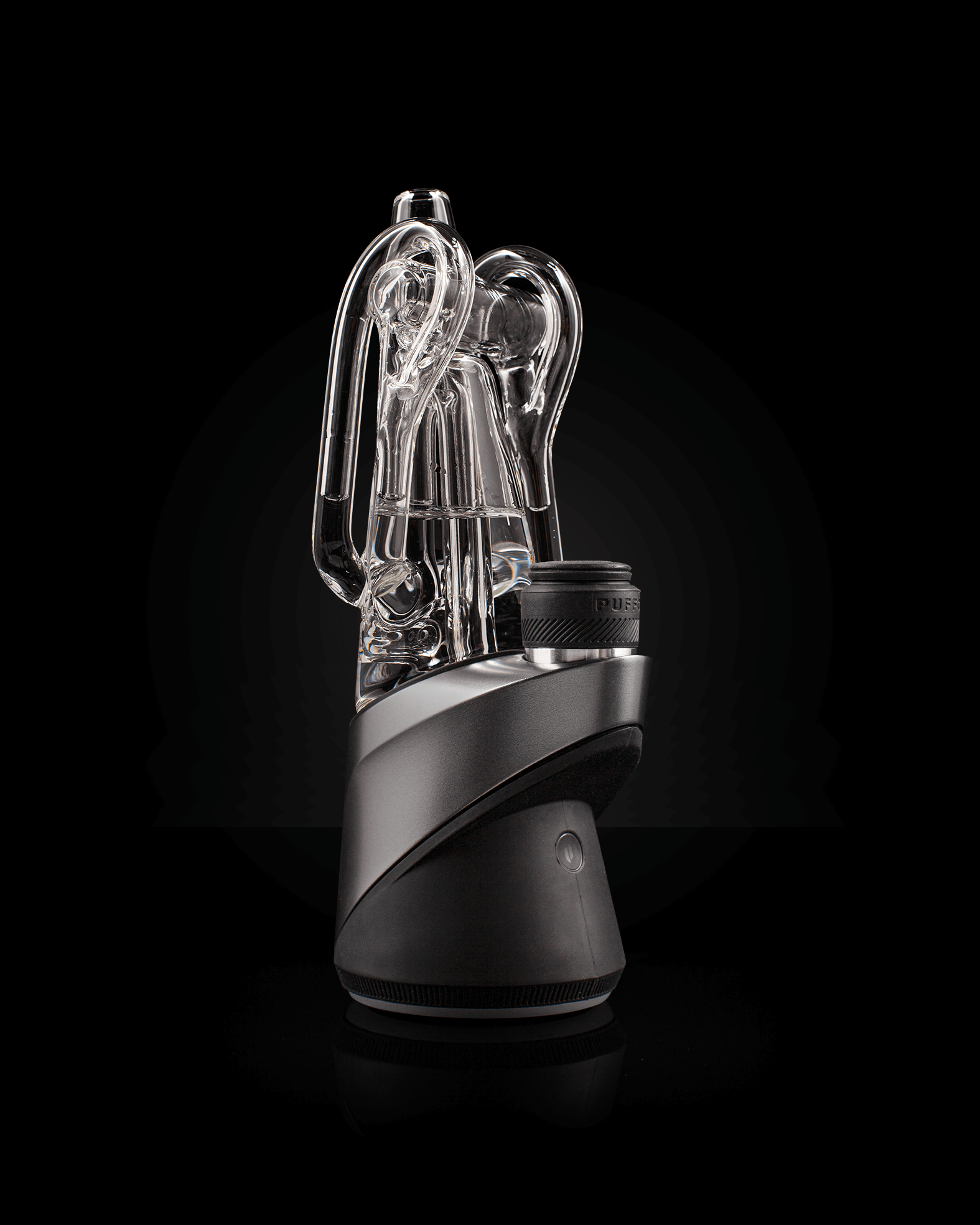 Angled front shot of clear Ryan Fitt recycler glass peak pro attached to black rig against black backdrop