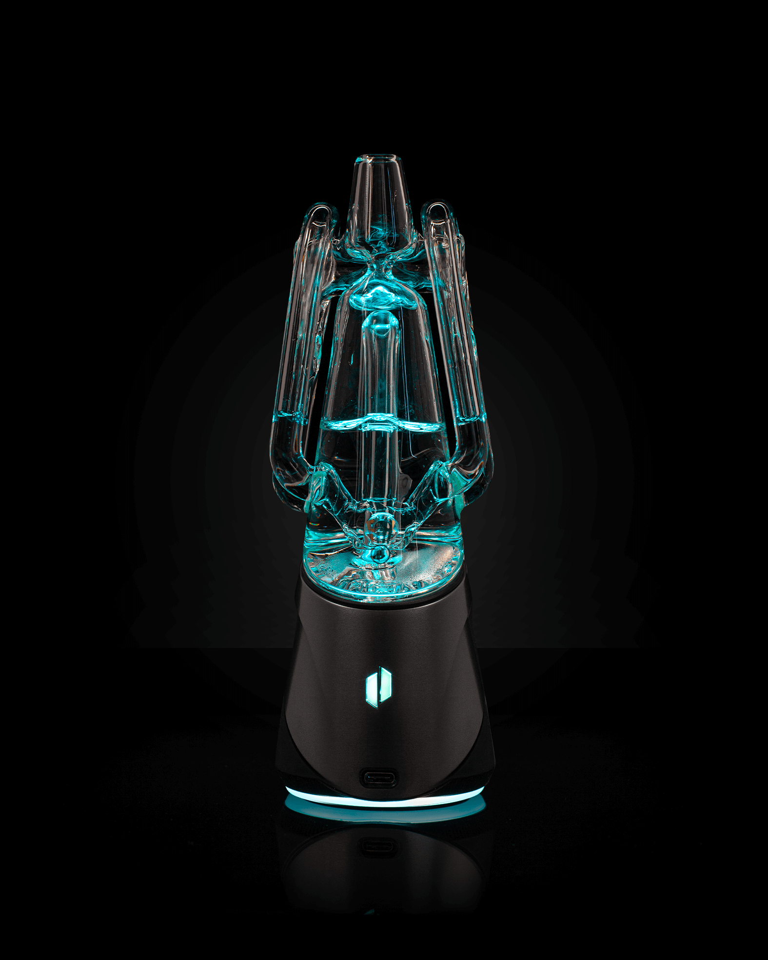 Back shot of clear Ryan FItt glass attached to black rig with blue light shining throughout the glass against a black backdrop