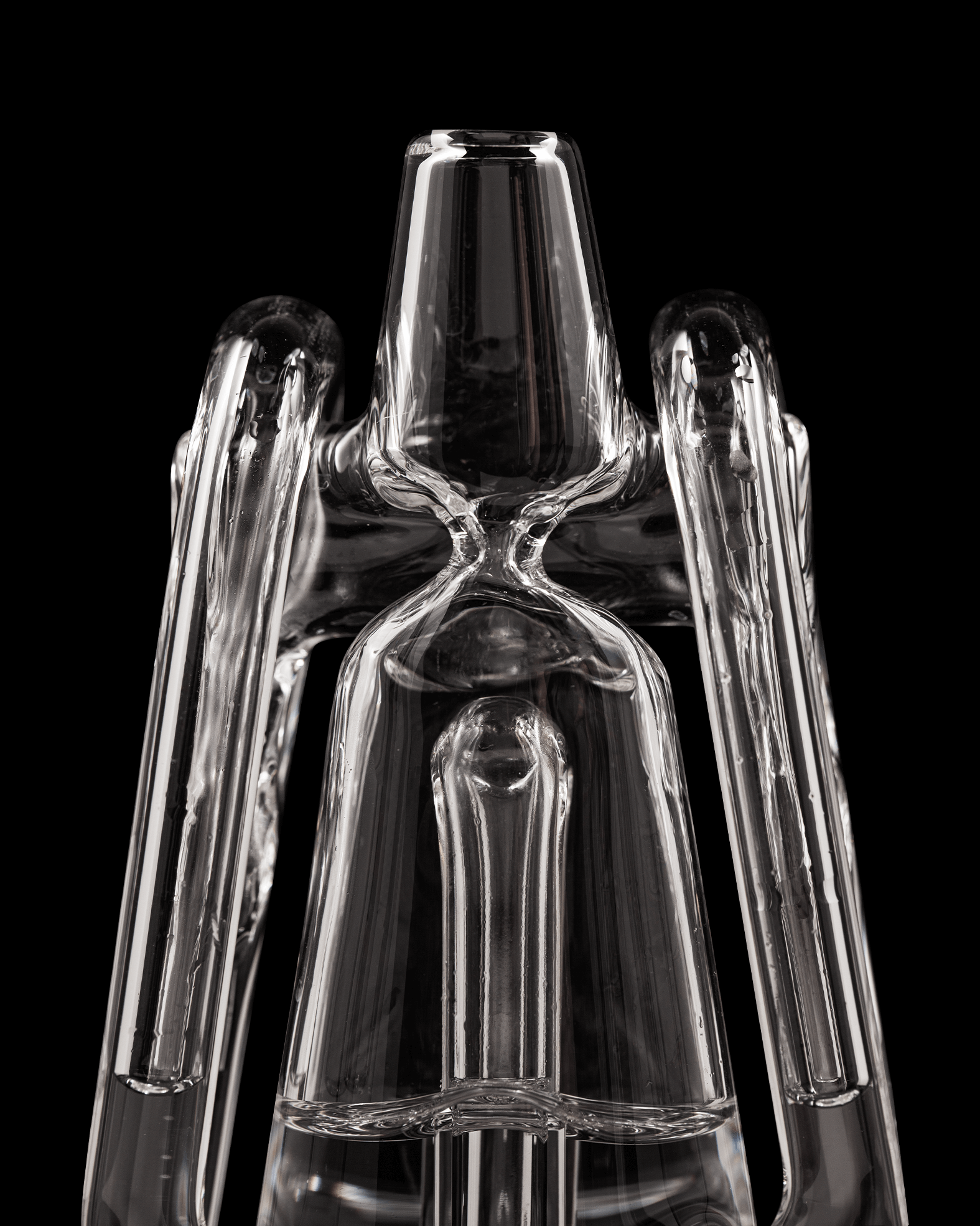 Close up of clear Ryan Fitt recycler glass peak pro against black backdrop